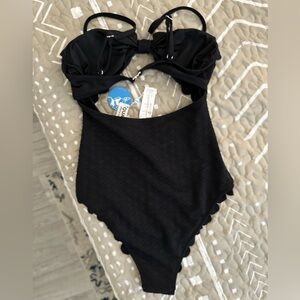 Cupshe one piece black swimsuit with adjustable straps.